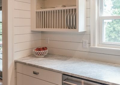 Open shelving and shiplap walls give a vintage feel with modern conveniences in this kitchen remodel in Atlanta