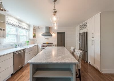 The marble island was painted gray for depth in this kitchen renovation in Atlanta.