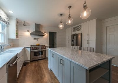 Marble counters and shiplap walls create a farmhouse feeling in this Atlanta kitchen remodel