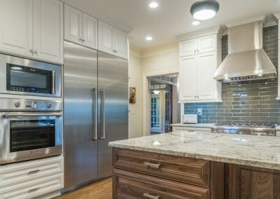 Ovens, refrigerator, backsplash and island in East Cobb kitchen remodeling project