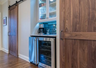 Barn doors and beverage center in East Cobb kitchen remodeling
