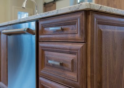 Close up of the warm-toned wooden cabinets in East Cobb kitchen remodeling project