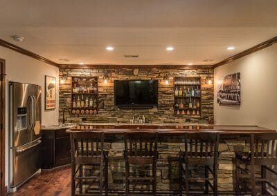 Bar, fridge, and sink in the basement home bar remodel in East Cobb