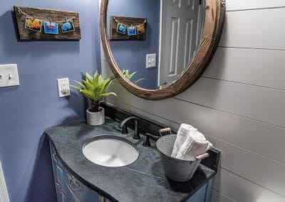 New powder room with repurposed vanity in East Cobb remodel