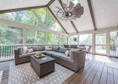Soaring vaulted ceiling with fan and tongue and groove and beams in screened porch remodel in East Cobb