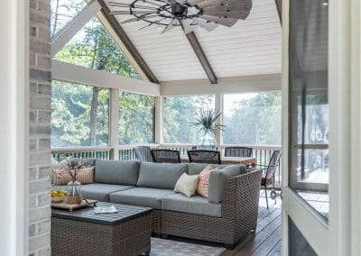 Interior screened porch with vaulted ceiling and ceiling fan
