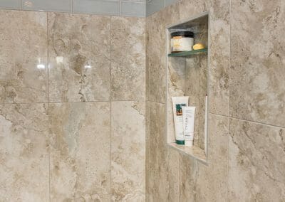 Niche, shelf, and tile detail in master bathroom remodel in Roswell