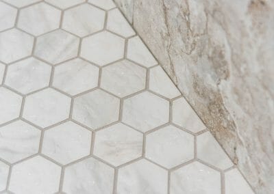 Hex tile floor in the master bathroom shower remodeling project in Roswell