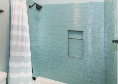 Glass tile and niche in nautical bath remodel in East Cobb