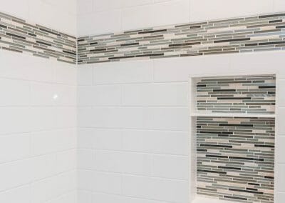 Glass tile and subway tile in master bathroom renovating project in Roswell