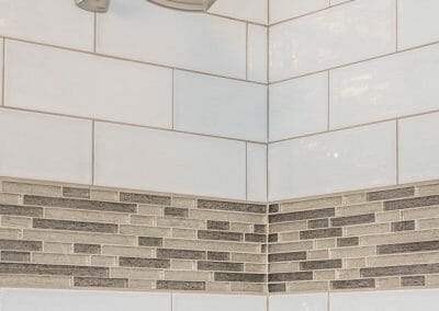 Tile detail and shower head in Roswell bathroom remodeling