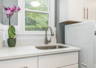Another view of the sink in the sunny laundry room created during the kitchen remodel in Sandy Springs