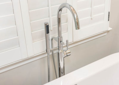 Floor-mount chrome faucet for freestanding tub, with hand shower
