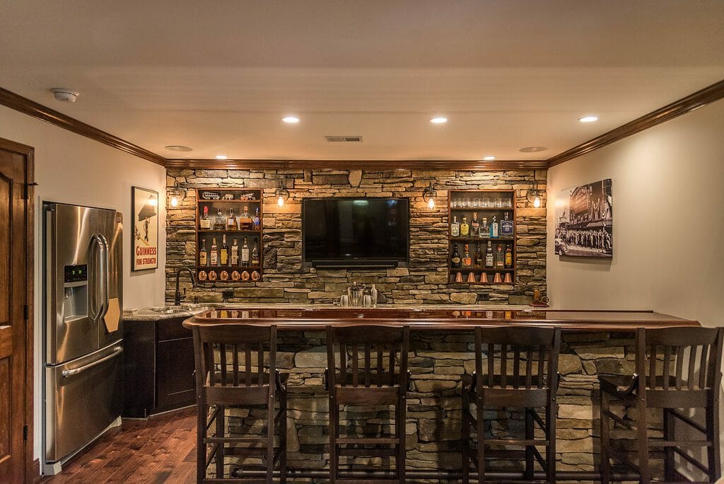 Bar, fridge, and sink in the basement home bar remodel in East Cobb