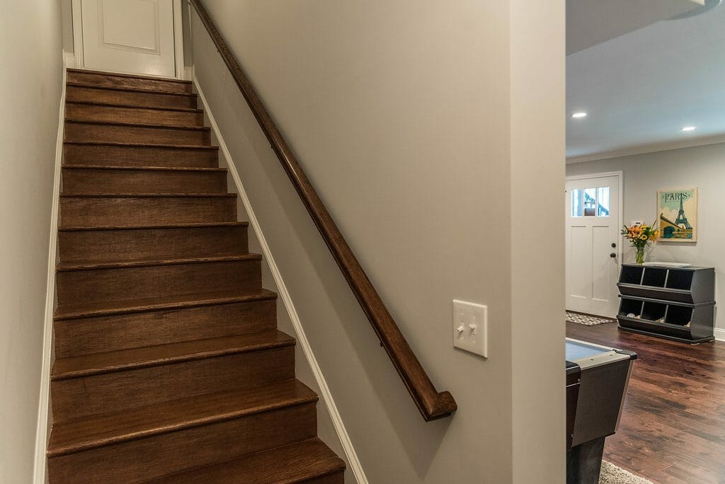 Stairs down to bar room in lower level remodel in East Cobb