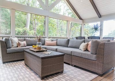 Sectional outdoor sofa and coffee table in screened porch remodel in East Cobb