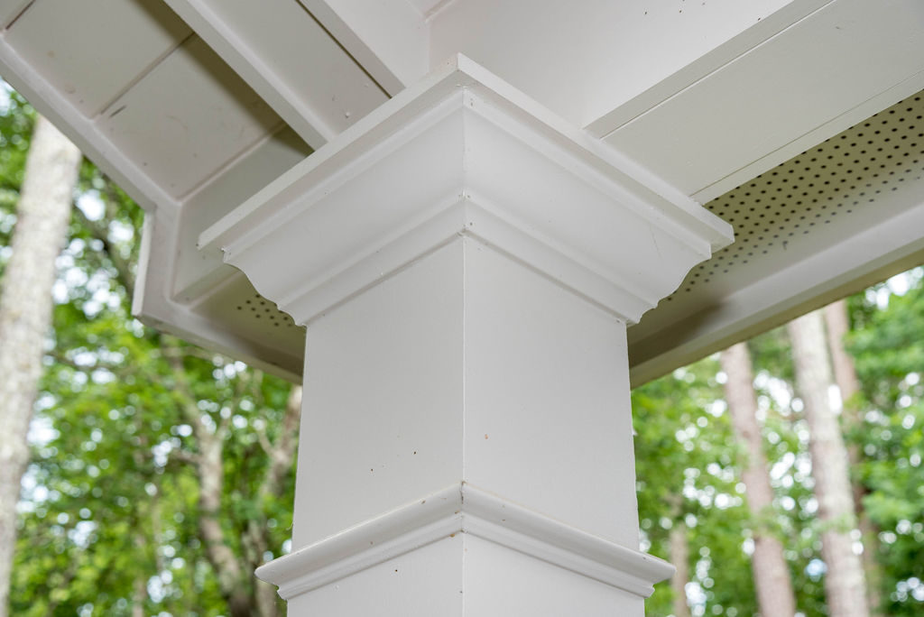 Porch renovation detail of corner post multi-piece trim.