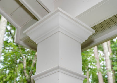 Porch renovation detail of corner post multi-piece trim.