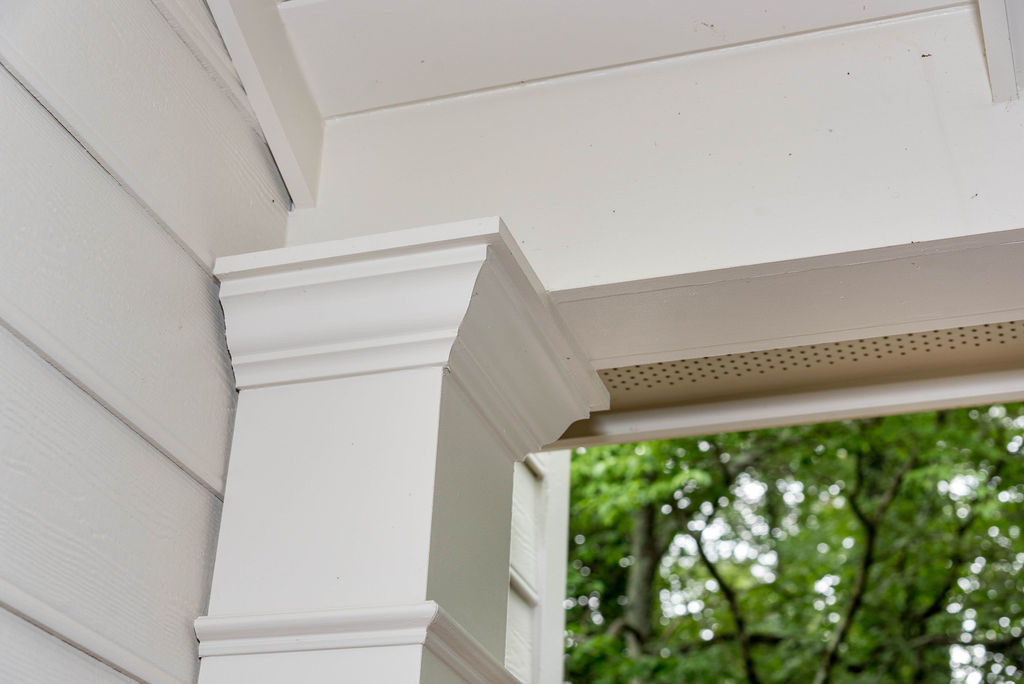 Porch renovation detail of custom trim on corner post.