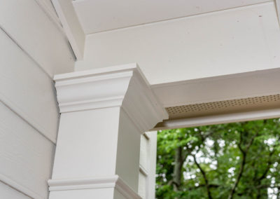Porch renovation detail of custom trim on corner post.